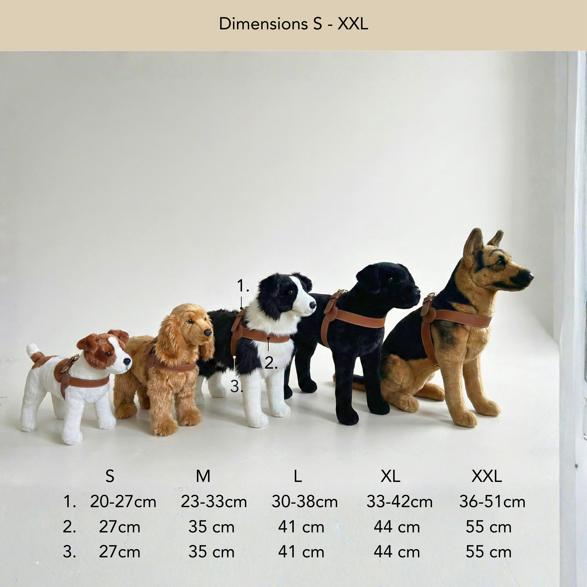 Set of toy dogs in various sizes on a wooden floor with size chart below. #lang_en