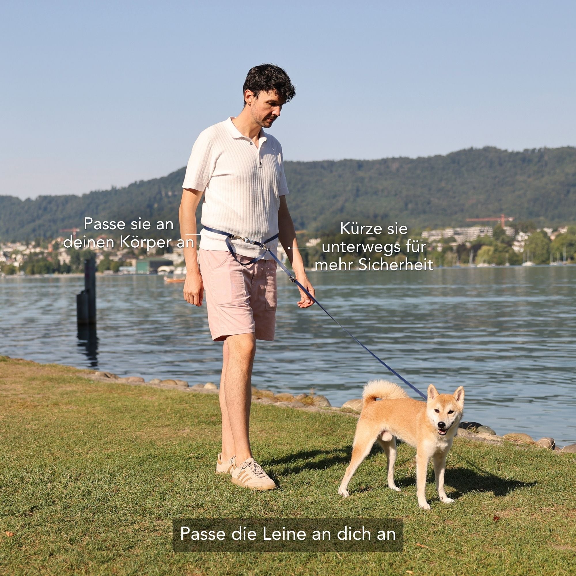 A man standing on a grassy lakeside with a Shiba Inu dog on a leash, with German instructional text overlaid on the photo. #lang_de