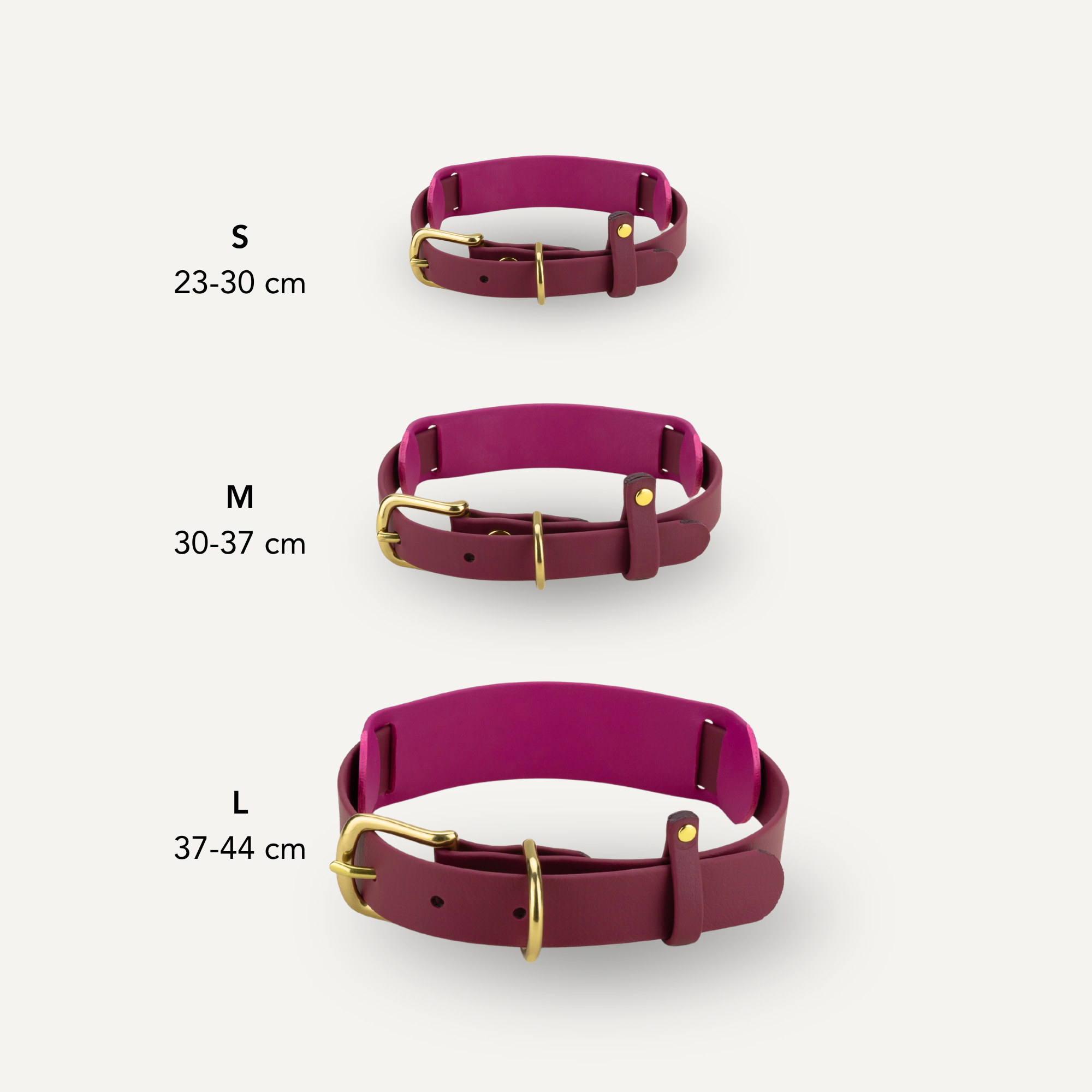 Three dog collars in a deep magenta color with gold-tone hardware, shown in sizes S (23-30 cm), M (30-37 cm), and L (37-44 cm) on a light gray background with size text labels.